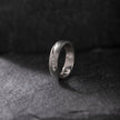Silver Men Diamond  ring with small diamonds on a dark textured surface