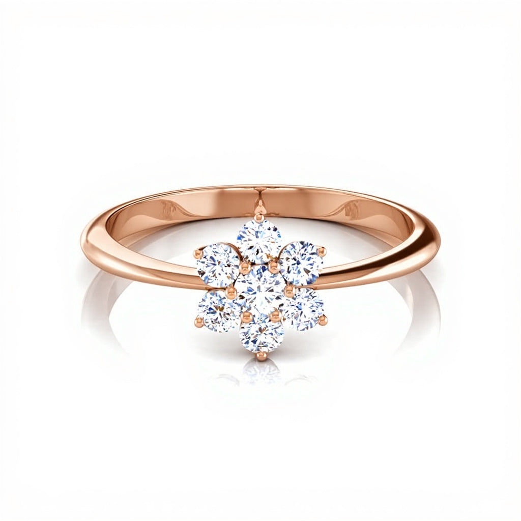 Rose gold ring with a diamond flower design on a white background