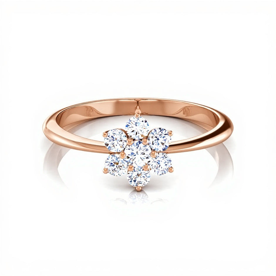 Rose gold ring with a diamond flower design on a white background