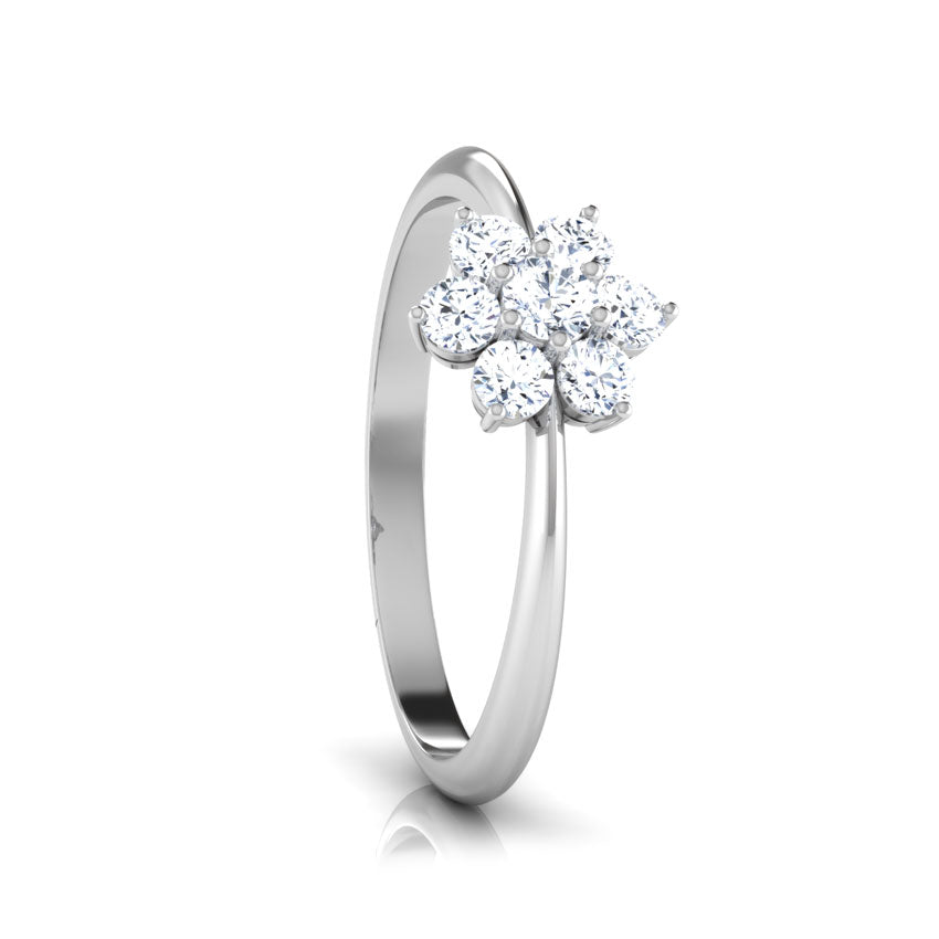Silver ring with a floral diamond design on a white background