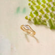 Gold ring with diamonds on a light background