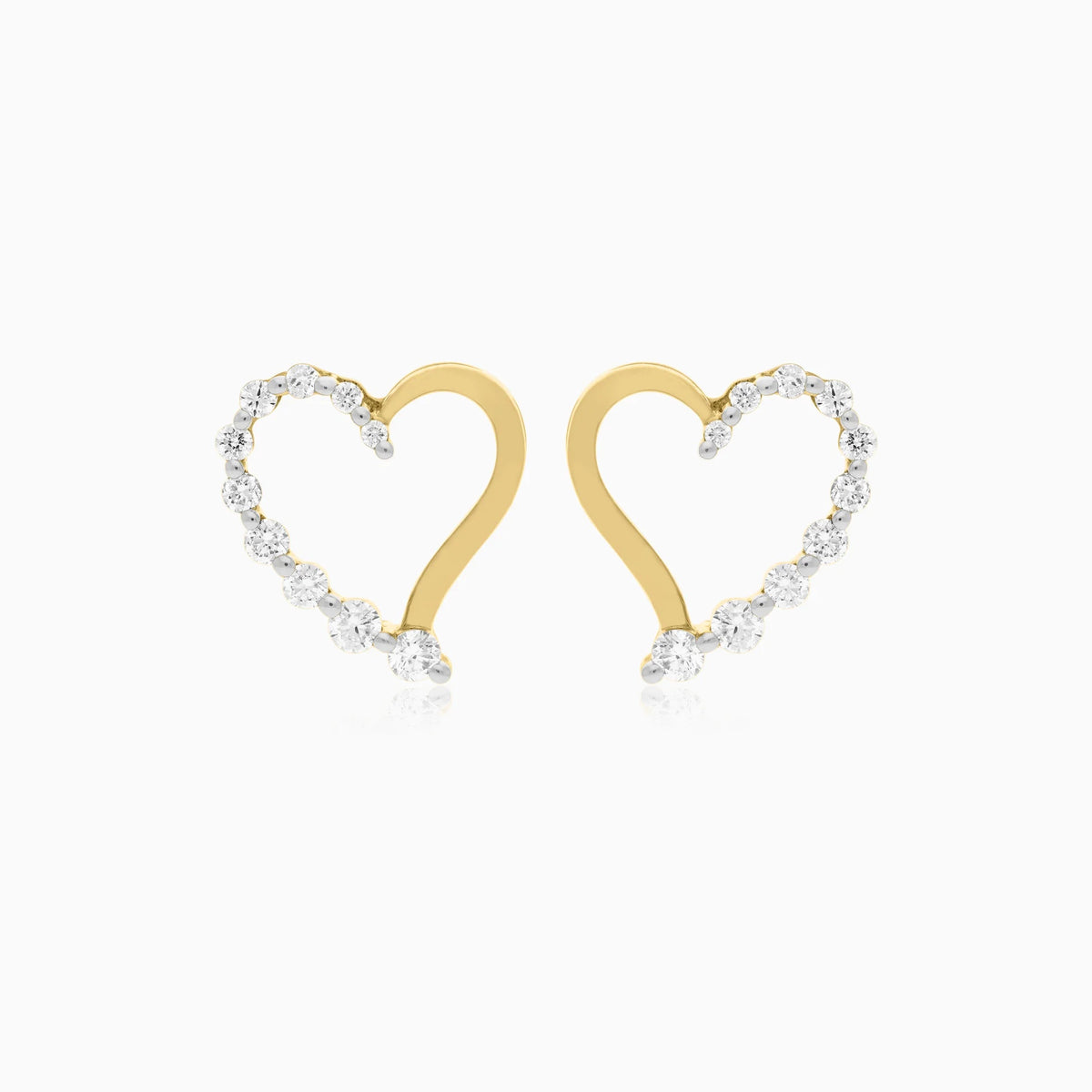 A pair of gold heart-shaped stud earrings with clear pavé-set round diamond along the outer edges, shown on a clean white background.