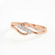 Rose gold ring with diamond accents on a light background