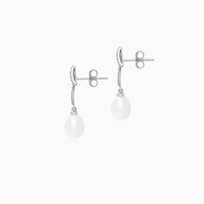 Pair of Danah luxury white gold drop earrings featuring lustrous round pearls accented with sparkling natural diamonds