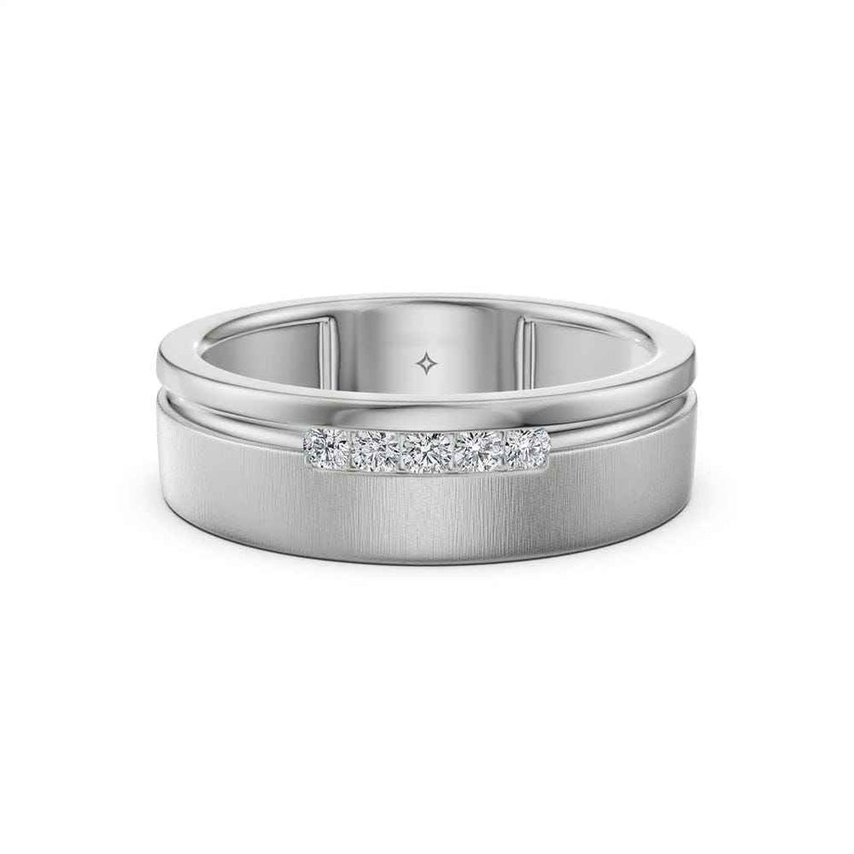 A silver-toned men's diamond ring with a brushed finish, a polished beveled edge, and a small channel-set row of clear stones on the front, shown on a white background.