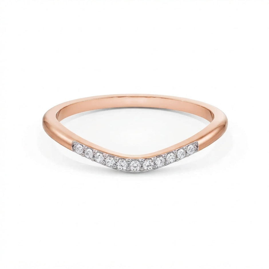 Curved pavé gold diamond band in rose gold