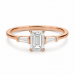 Emerald-cut three-stone lab-grown diamond ring with baguette sides in 18K rose gold