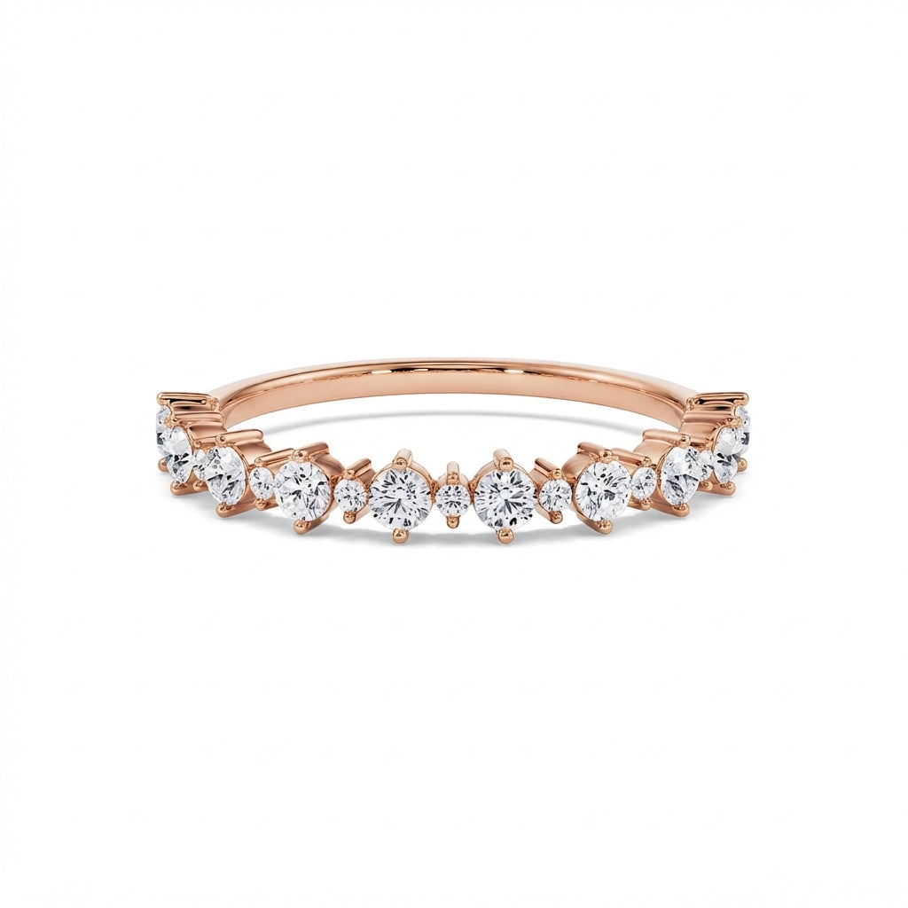 Graduated round diamond gold ring in rose gold