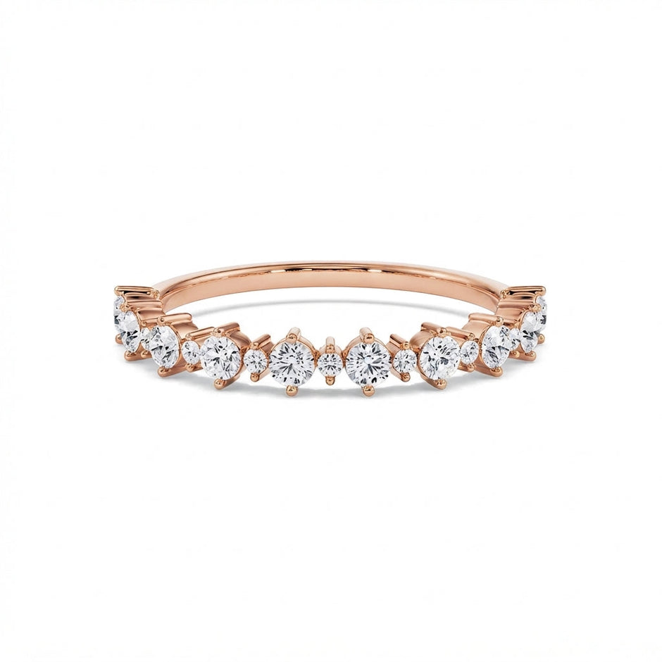 Graduated round diamond gold ring in rose gold