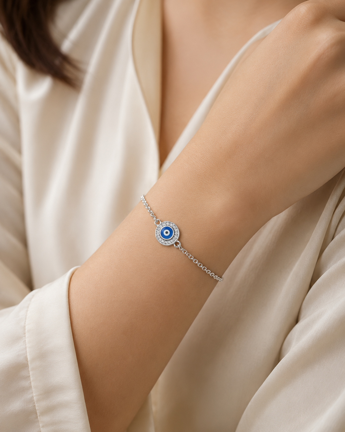 Rida Evil-Eye Motif Women Silver Bracelet worn on a woman's wrist, white 925 sterling silver lifestyle view